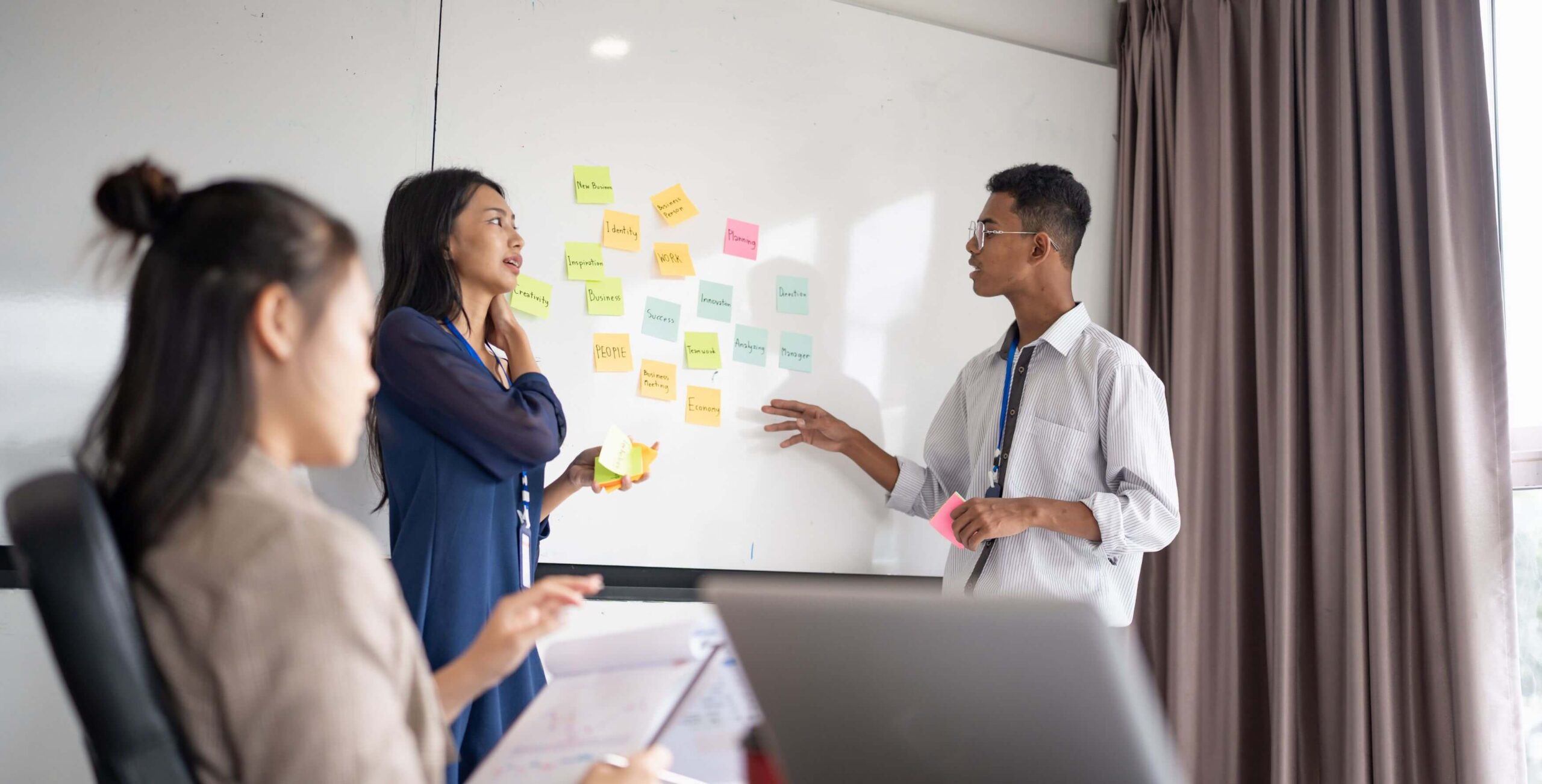Diverse team collaborating on a business structure representing effective team building for agency growth.