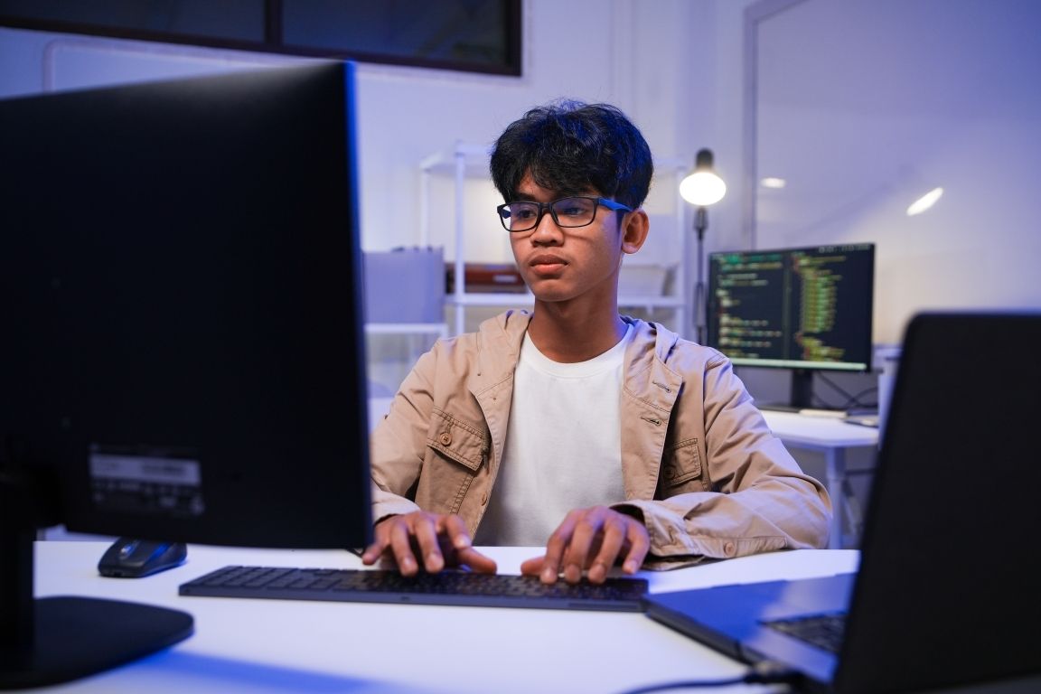 A digital marketer configuring the GoHighLevel WordPress plugin on a dual-monitor setup.
