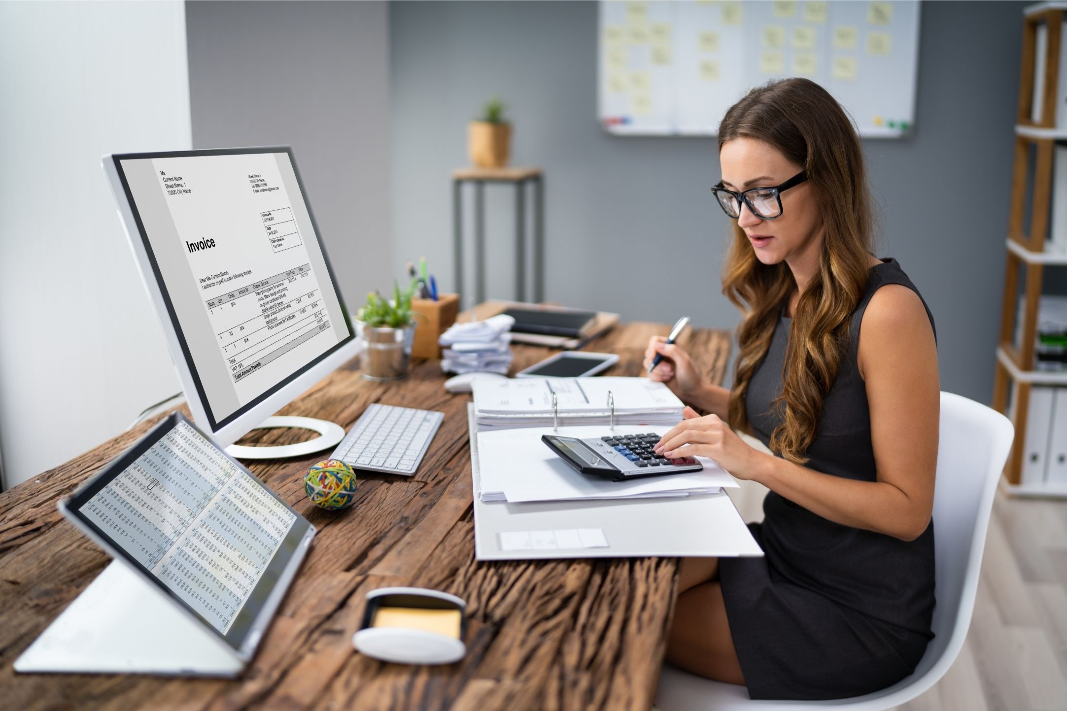 An Australian agency owner conducting tech stack auditing for agencies on a dual-monitor setup in a modern Melbourne office.