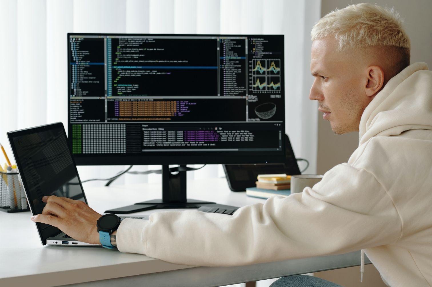 A technical support specialist carefully troubleshooting GoHighLevel errors on a multi-monitor setup.